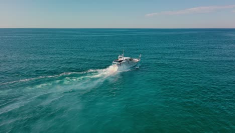 luxury yacht navigating on blue rippled sea surface