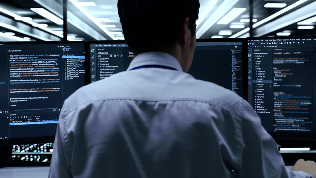 Programmer Working on Code in Data Center