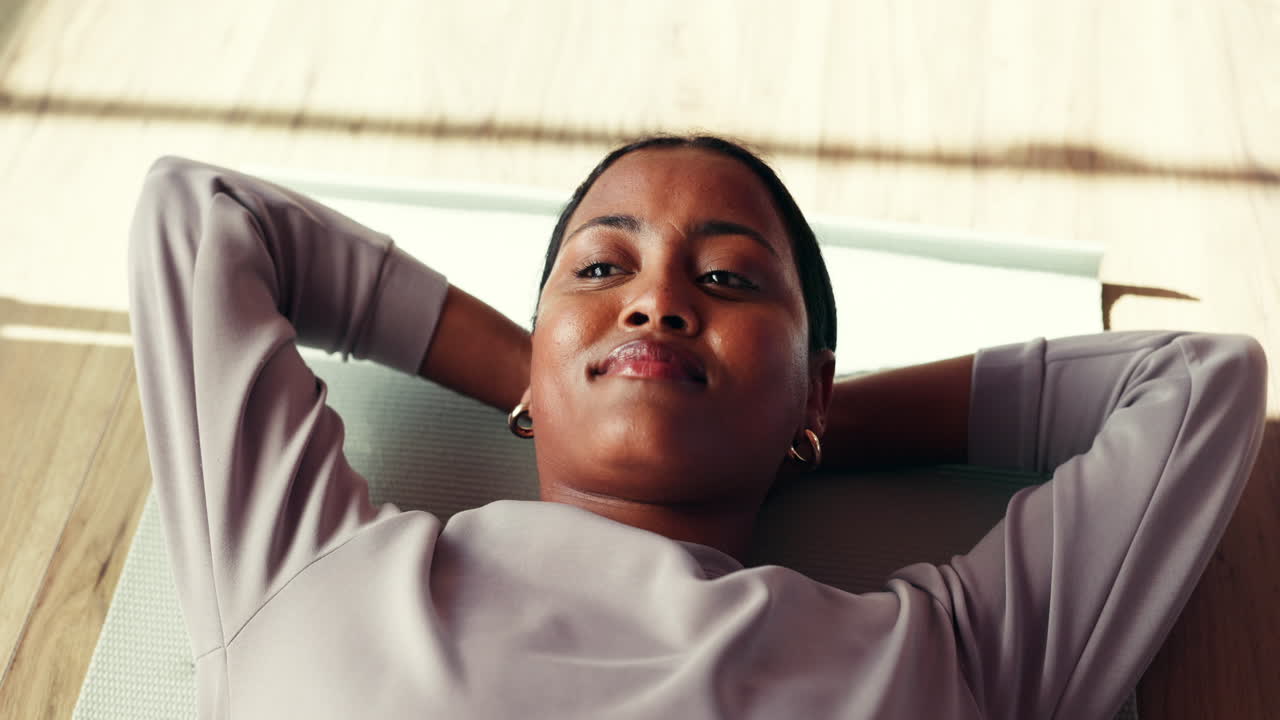 Woman Resting on Exercise Mat