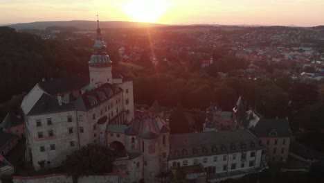 The-aerial-shot-of-the-magical-castle-in-Frydlant-in-Czech-Republic-during-sunset