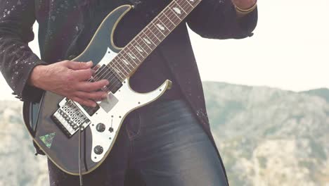 guitarist playing electric guitar