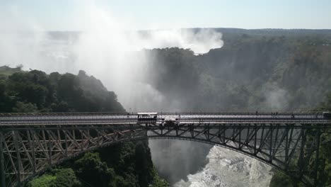 aerial drone view of victoria falls bridge, in between zambia and zimbabwe