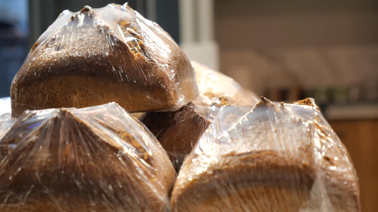 Loaves of Bread Wrapped in Plastic