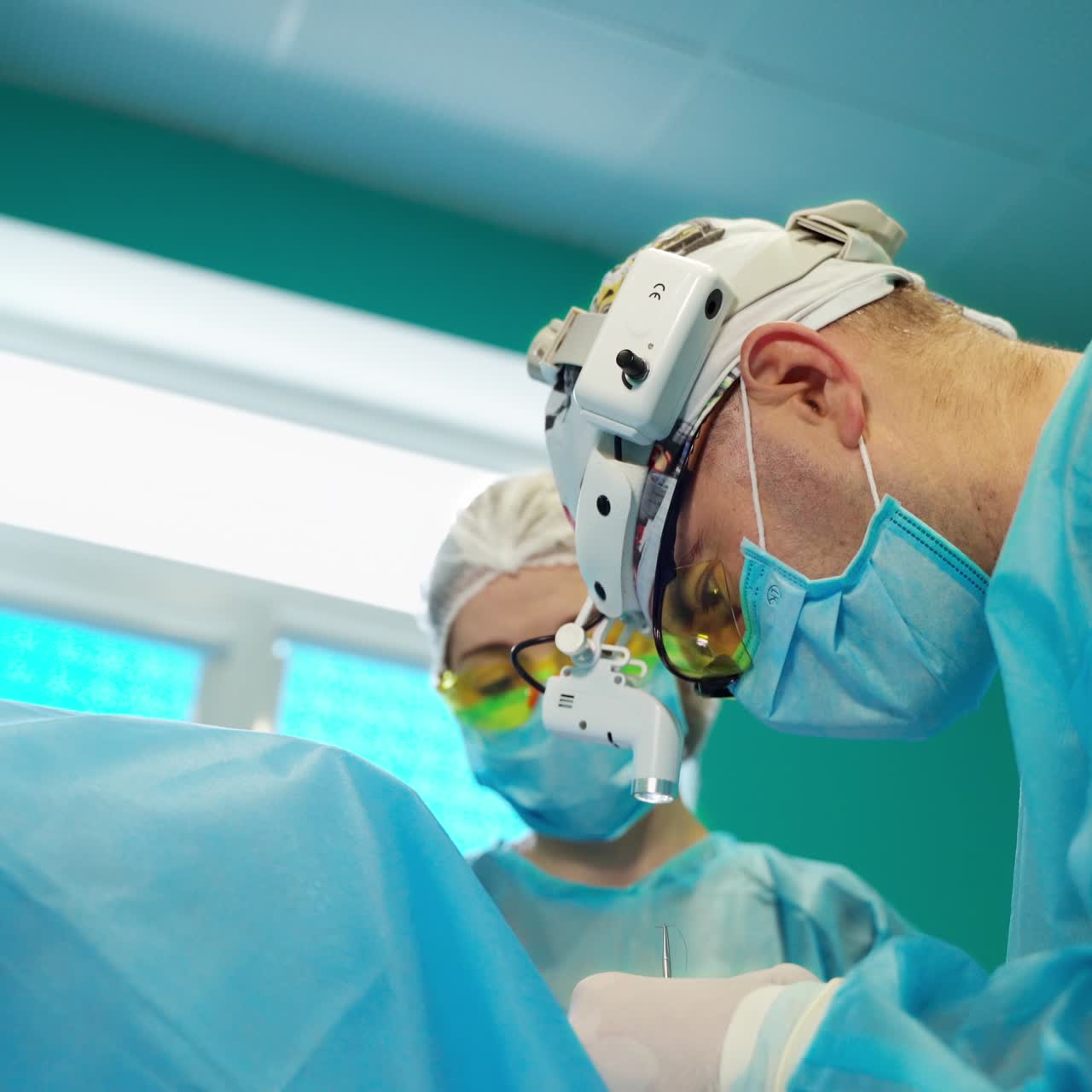 Doctors concentrating on patient