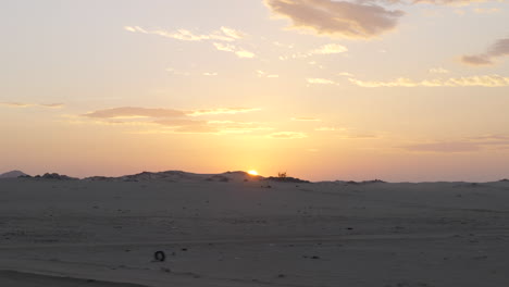 golden hour sunset over desert sand dunes