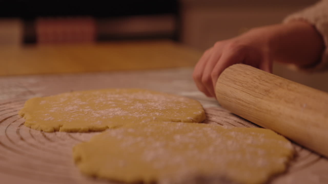 Woman rolling out dough for cookies