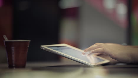 Woman-typing-on-touchpad