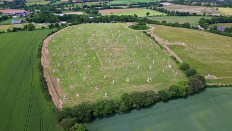 distant panoramic drone movement near the valley of saints historical site with legendary and monumental sculptures, carnoet, brittany, france