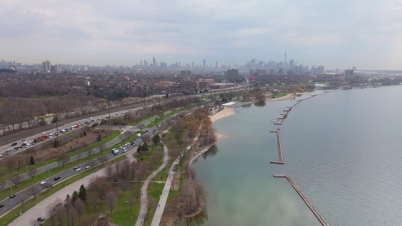 Lake Ontario with Toronto’s modern skyline in the background, aerial drone establishing