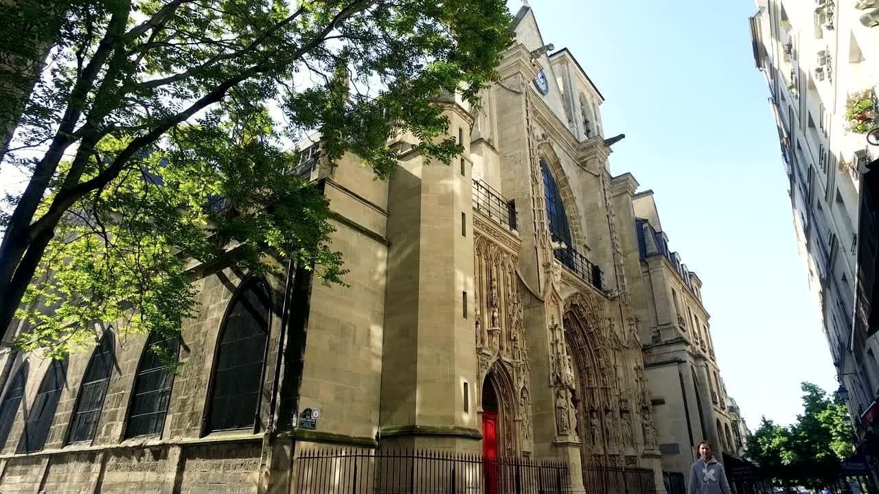 Church of Saint-Merri with people in Paris, France