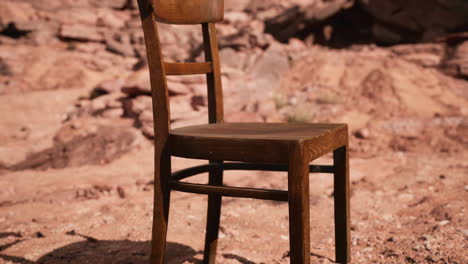 old wooden chair on rocks of grand canyon