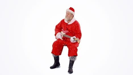 Snow-falling-over-santa-claus-playing-an-electric-guitar-against-grey-background