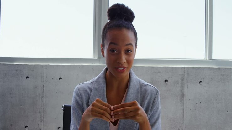 Front view of African American Businesswoman interacting in a modern office 4k