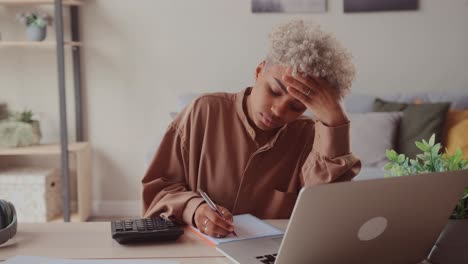 african woman accounting managing personal finances in computer e banking app
