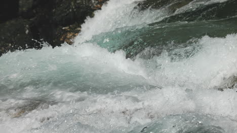 close panning view of fresh and clear water rapids in slowmotion