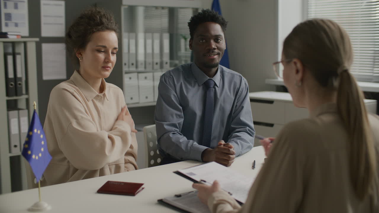 Young Diverse Couple Attending Immigration Interview at EU Embassy
