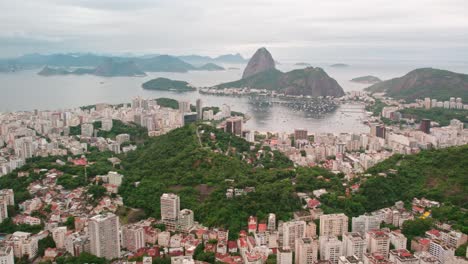 Wide-Aerial-establishing-shot-of-Rio-de-Janeiro-Cityscape-with-Sugarloaf-Mountain-in-Guanabara-Bay