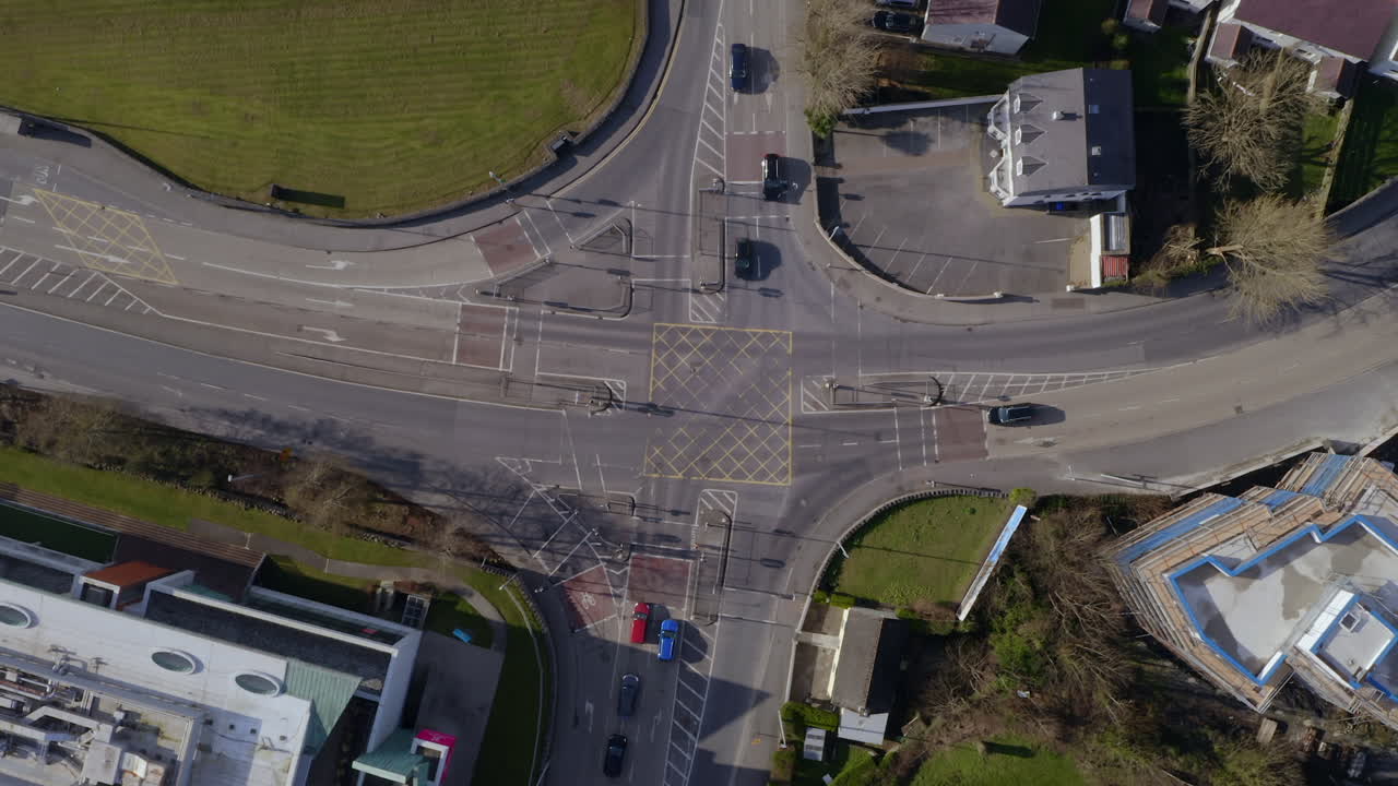 Dynamic aerial reveal: Galway city unfolds from junction to stunning Lough Atalia