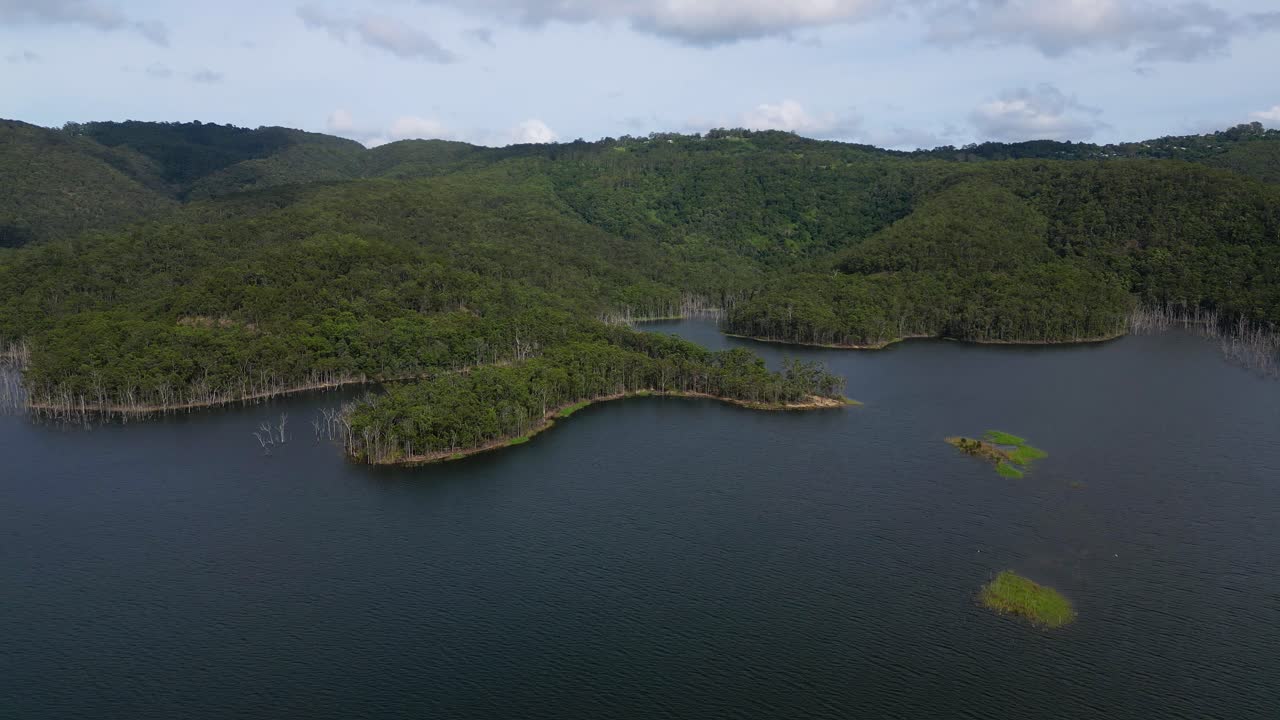 Left to right aerial views of Advancetown Lake near the Western Boat Ramp on the Gold Coast Hinterland.