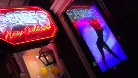 scores sports club in new orleans features dancing lady on the sign