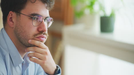 Portrait-of-Sad-Businessman-with-Glasses