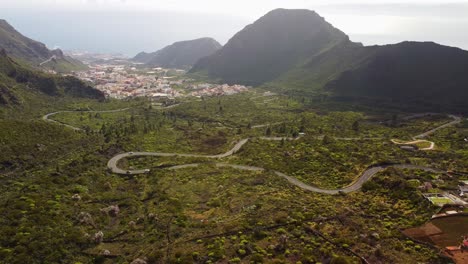 Establishing-shot-aerial-shot-of-twisted-curvy-road-in-Santiago-Del-Teide,-Tenerife