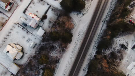 Aerial-view-of-snowy-roads-and-cityscape-of-Sundsvall,-Sweden