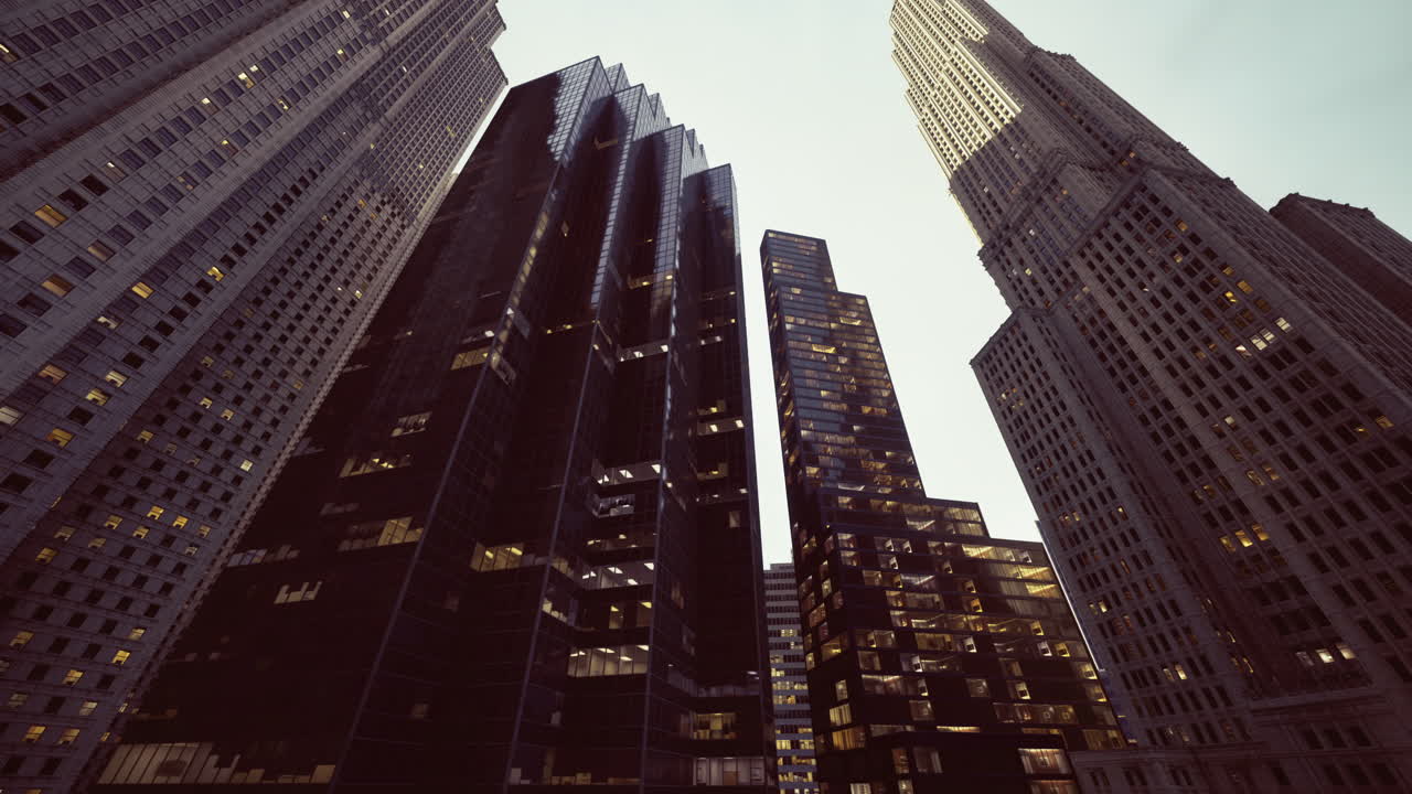 Urban skyscrapers towering against a twilight sky in a bustling city
