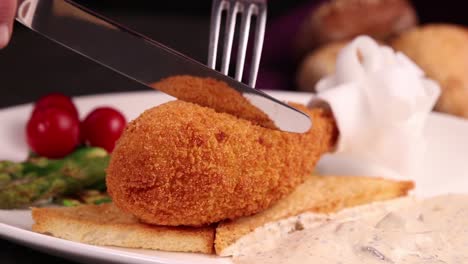 delicious breaded chicken cutlet with toasted bread and sauce