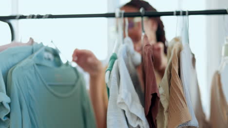 creative woman, fashion and checking clothing rack