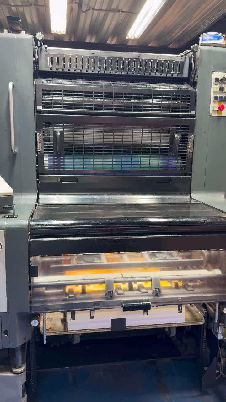 Industrial printing machine running, showcasing efficiency and precision