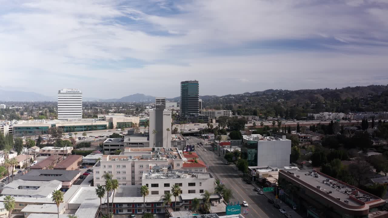 Rising and panning aerial shot of Ventura Blvd. looking east towards Interstate 405 in Encino, California. 4K