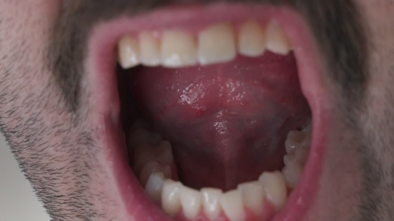 Opening mouth in slowed motion while in close up