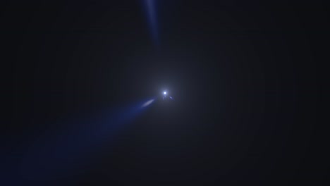 blue lens flare in dark background