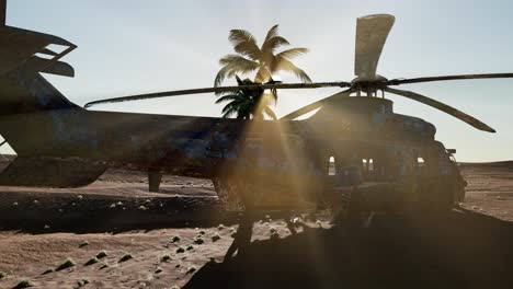 old-rusted-military-helicopter-in-the-desert-at-sunset