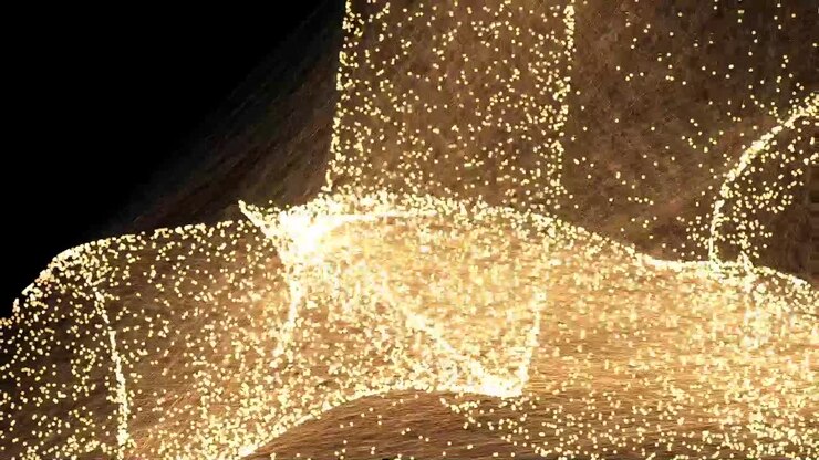 Punti dorati di particelle danzanti in festa