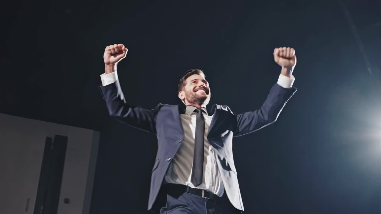 Businessman Celebrating Success on Stage