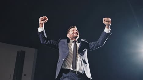 businessman celebrating success on stage