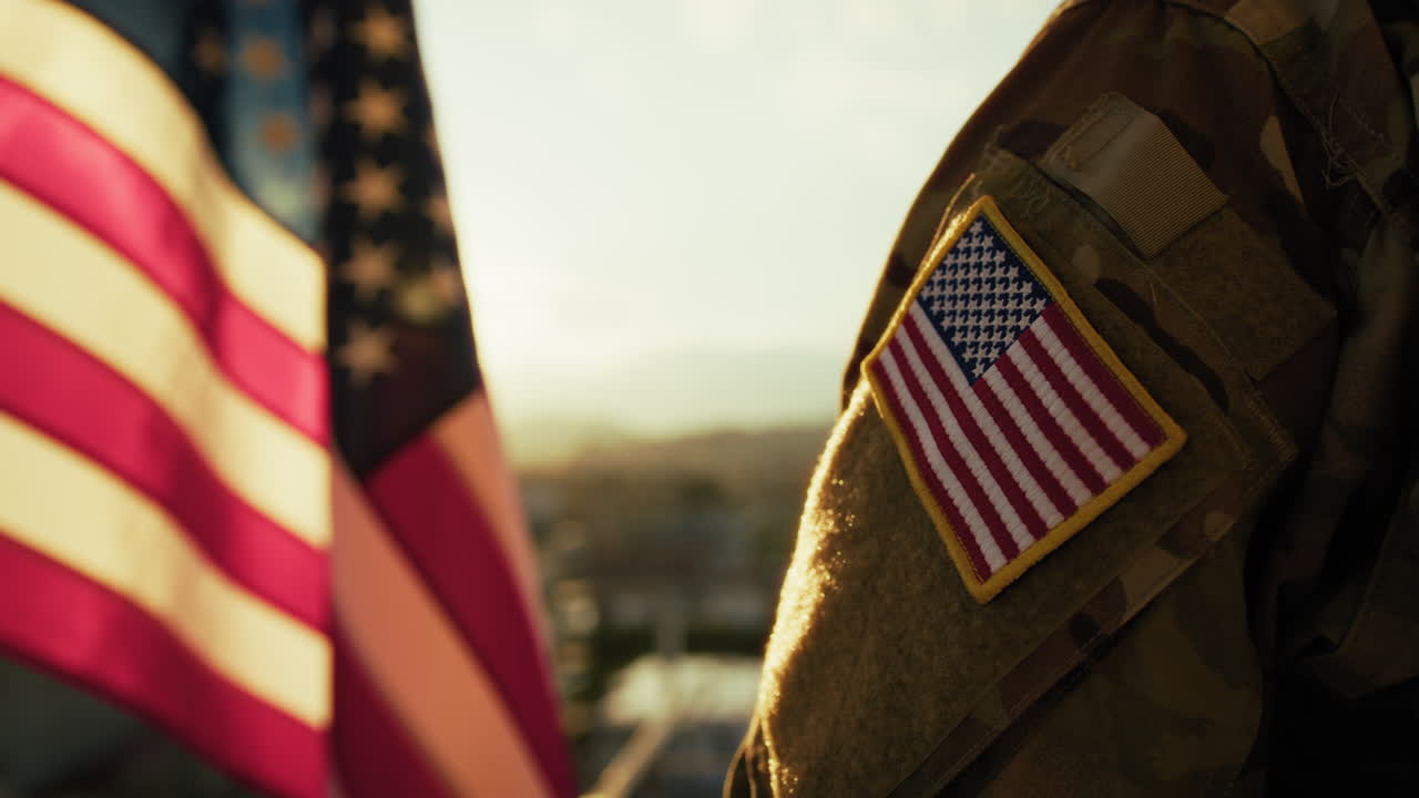 Soldier In Front Of American Flag At Sunset During Memorial Day