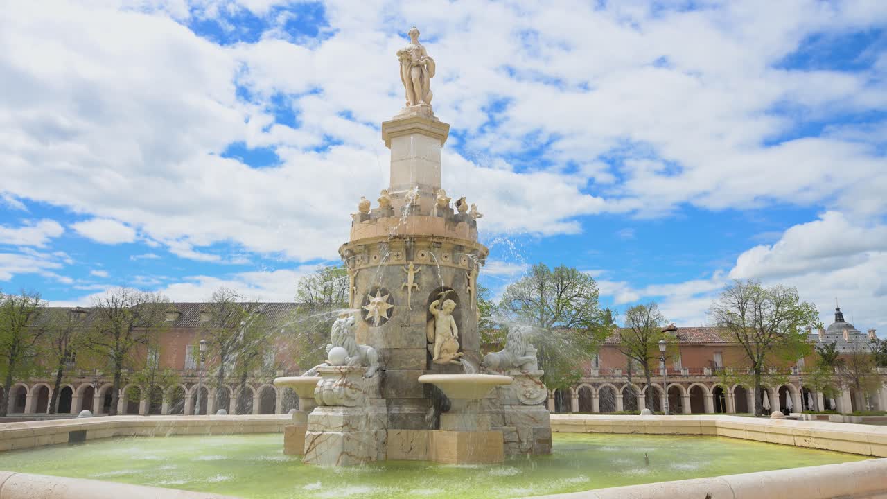 ARANJUEZ, SPAIN - The historic Fuente de la Mariblanca (Fountain of Mariblanca) splashes water on a sunny day in the Plaza de San Antonio, a famous town landmark.