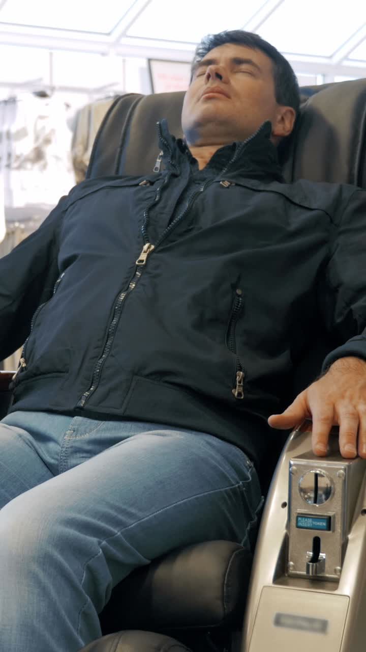 Man Relaxing in Massage Chair