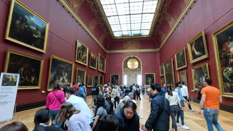 visitors exploring art in louvre museum gallery