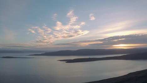 reyykjavik to westfjords iceland tour - panoramic view of peaceful islands surrounded by water in westfjords at sunset - aerial drone shot