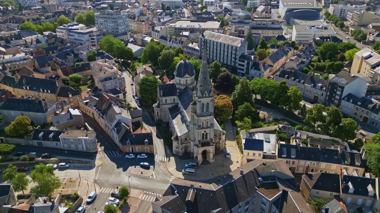 Église Notre-Dame de Châteauroux and surrounding town, France. Aerial drone orbiting