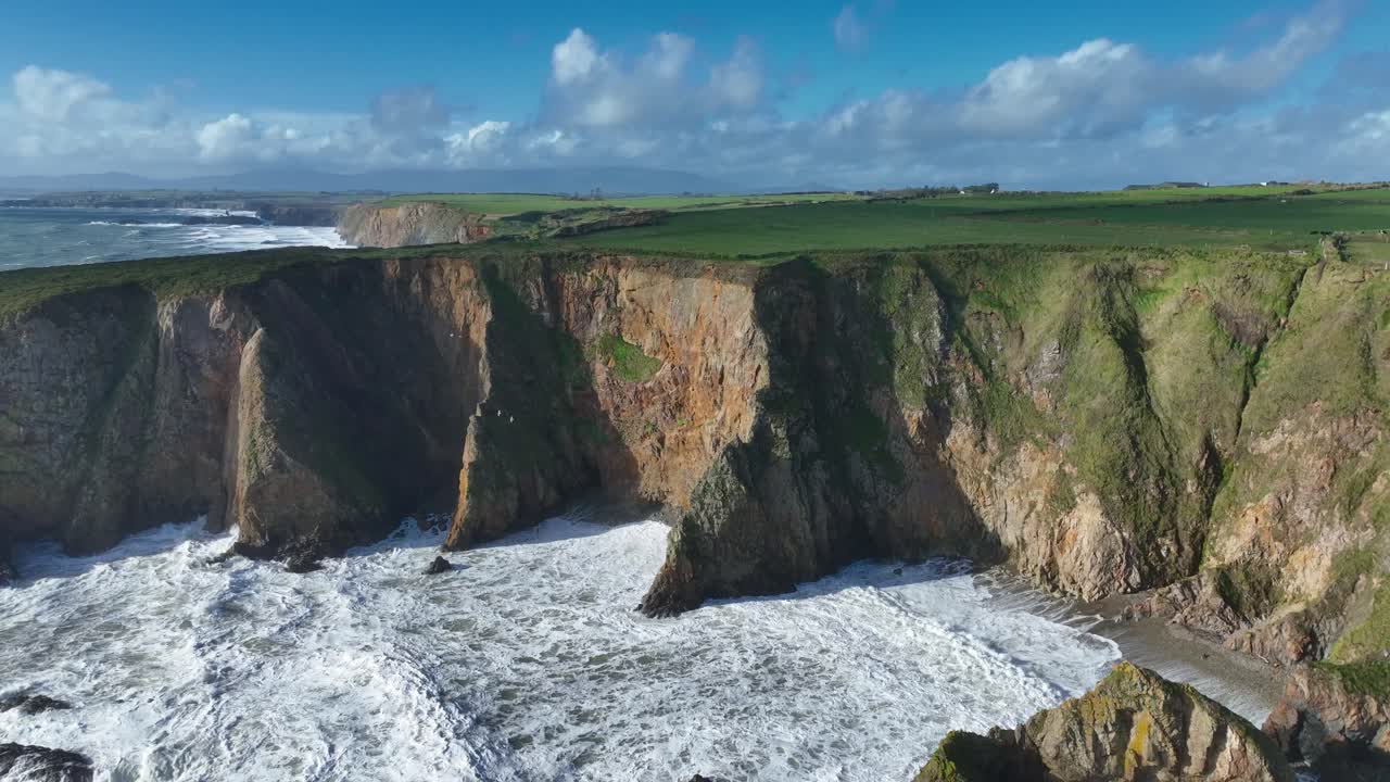 Epic Ireland stormy autumn on the Copper Coast Waterford drone pullback dramatic seas