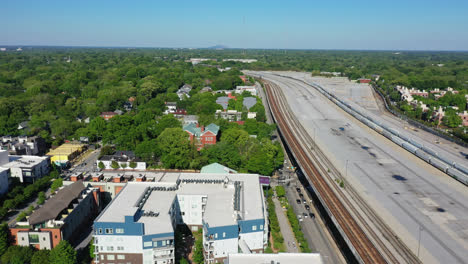 american neighborhood beside railroad with parking train in suburb of atlanta city,usa