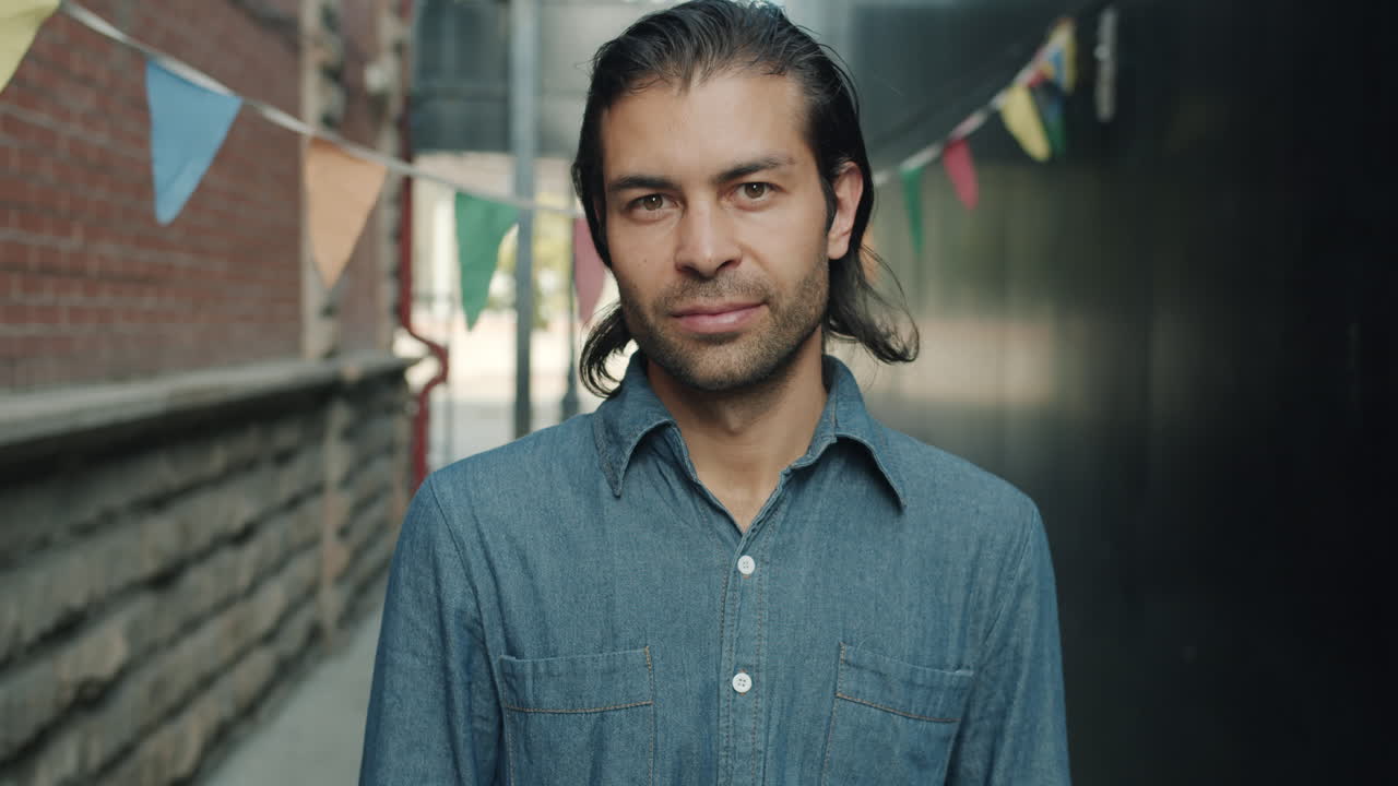 Man in Denim Shirt in Urban Alley