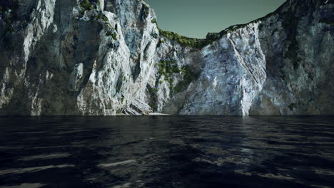 View of a high cliff and black ocean