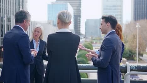 business professionals having an outdoor meeting