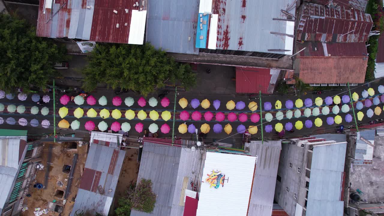 Top Down Drone Shot of Colorful Umbrella Street in San Juan la Laguna, Lake Atitlan, Guatemala
